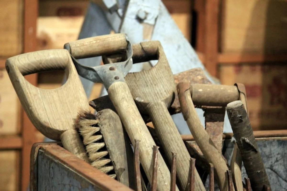 rusty garden tools in a messy shed
