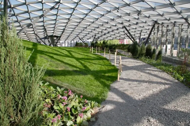 modern polycarbonate greenhouse in backyard Germany