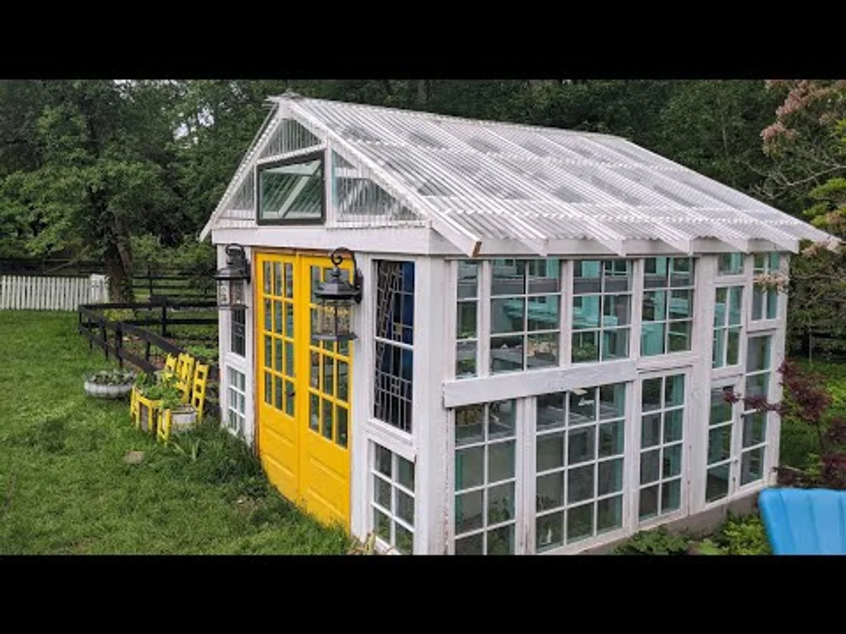 DIY greenhouse with recycled materials in a German garden