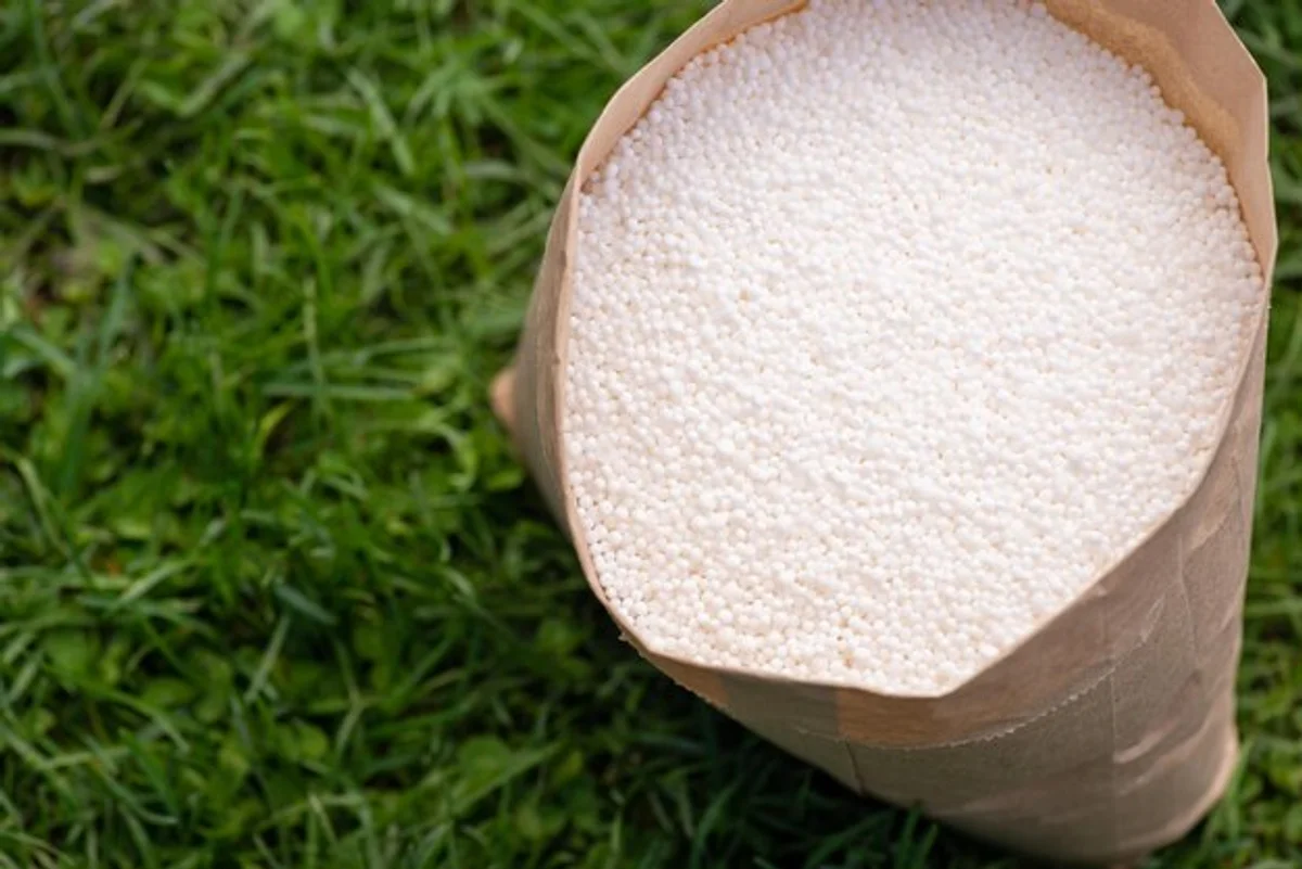 bag of fertilizer spilled on soil