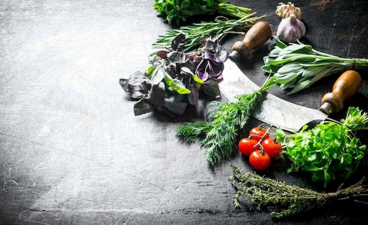 tomato and garlic plants together in garden