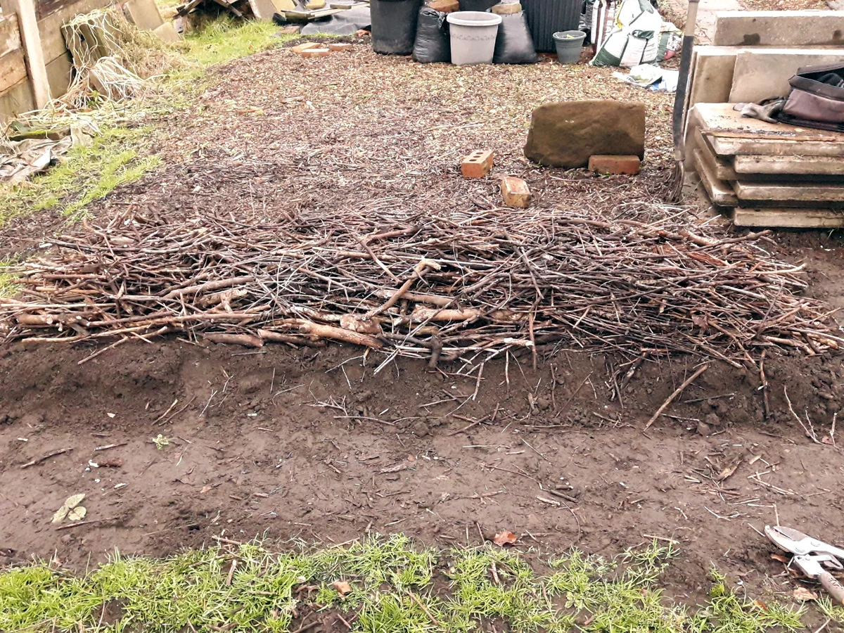 homemade compost with chopped branches close up Germany allotment