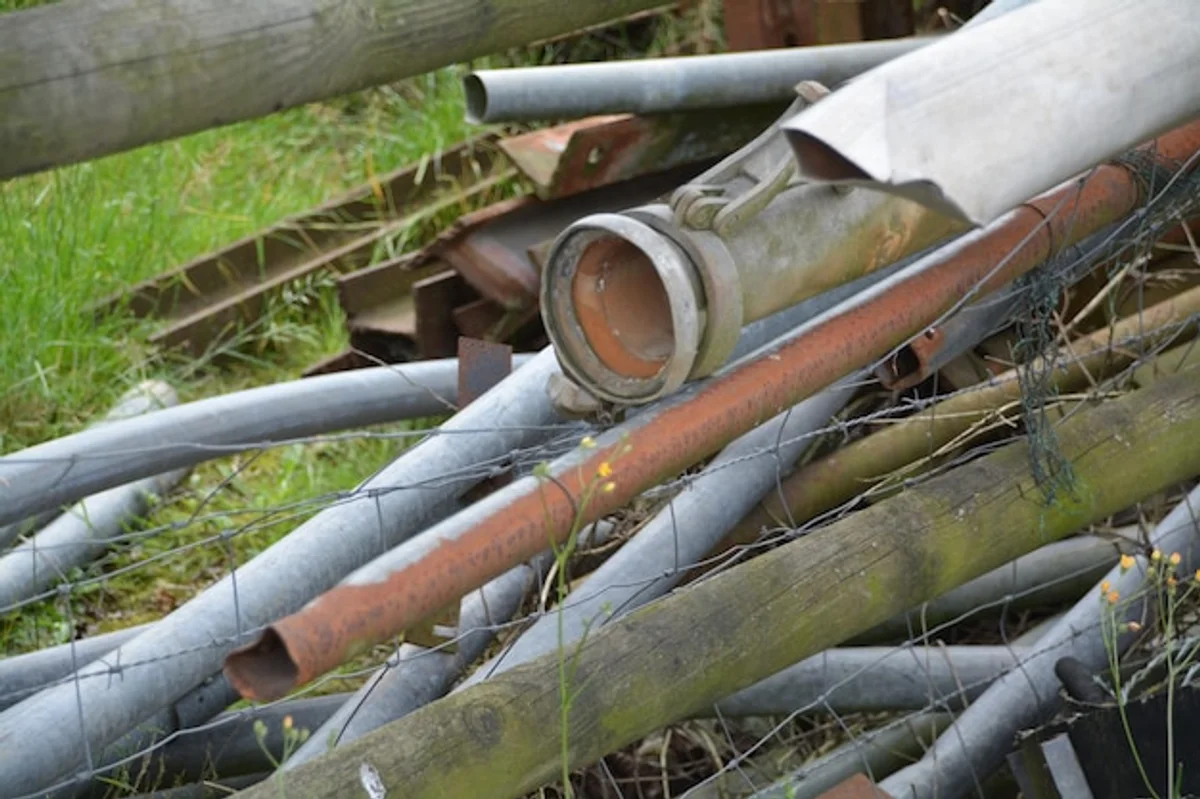 old garden hose as edge protector in garden